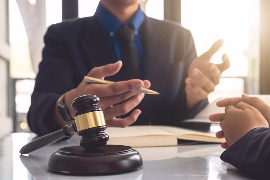 Advocate explaining legal strategy during a client consultation
