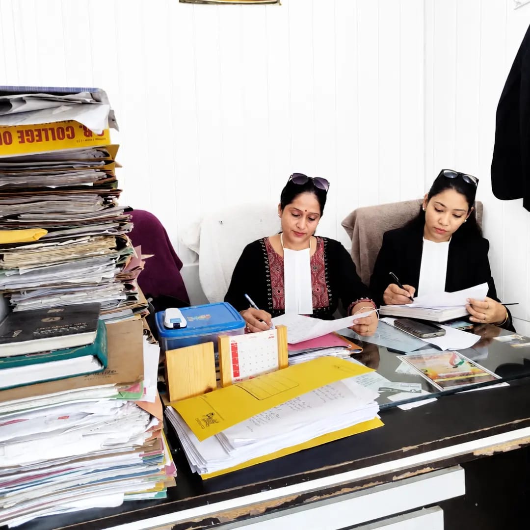 Advocates at Tyagi & Associates reviewing case files in chamber